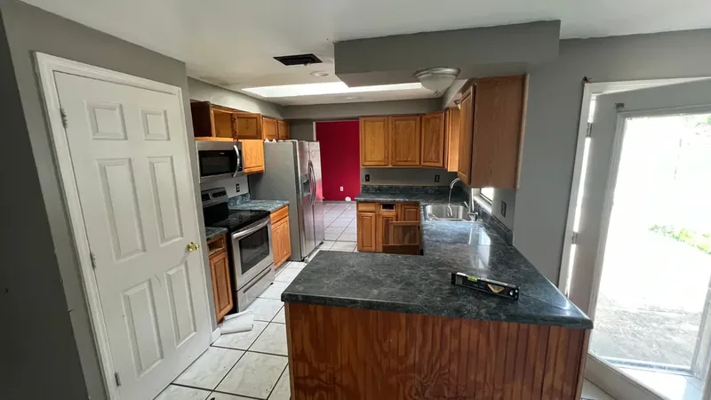 Dated kitchen before, sold to us as-is
