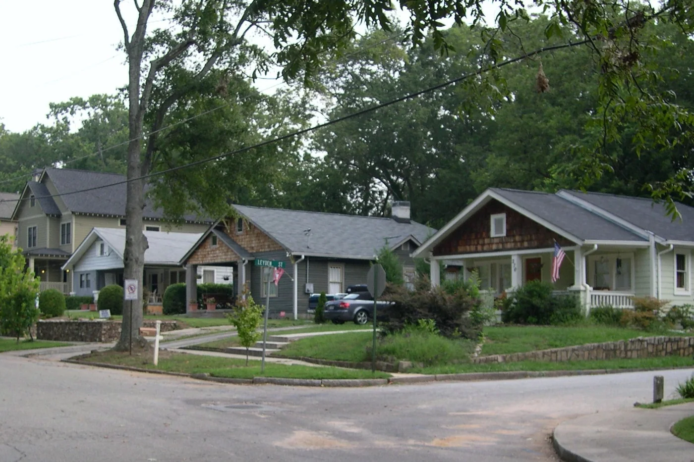 A row of modest craftsman bungalows on an ordinary residential street in the Atlanta area