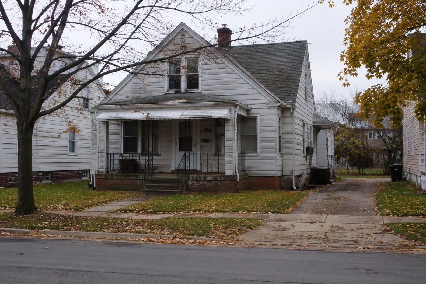 A modest older single-family house in Cleveland that needs work, the kind of home usually sold as-is