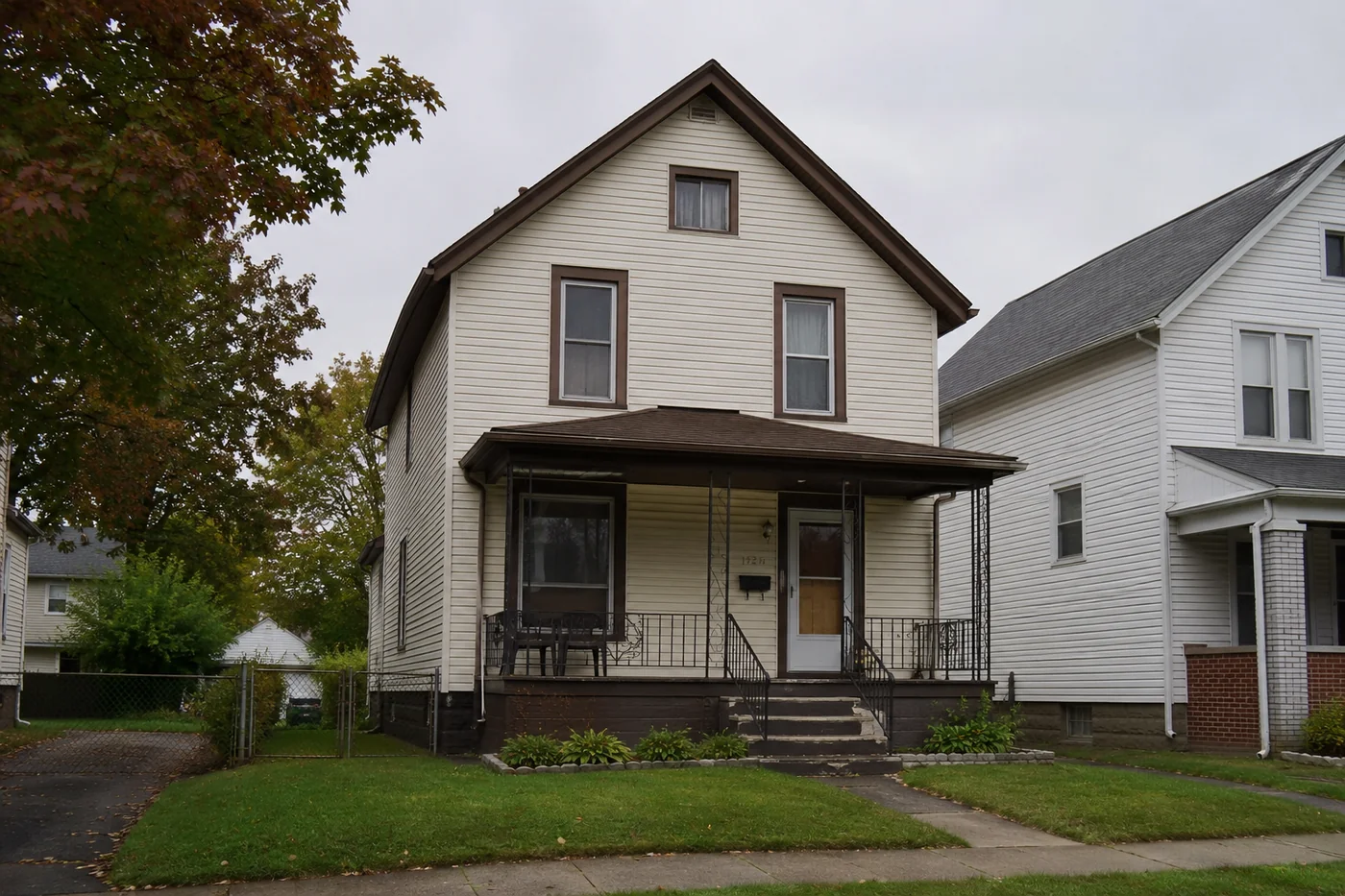 A modest older single-family house on an ordinary Cleveland street, the kind of home most affected by property tax delinquency