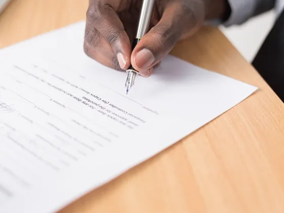 Signing the closing paperwork after every lien payoff was settled