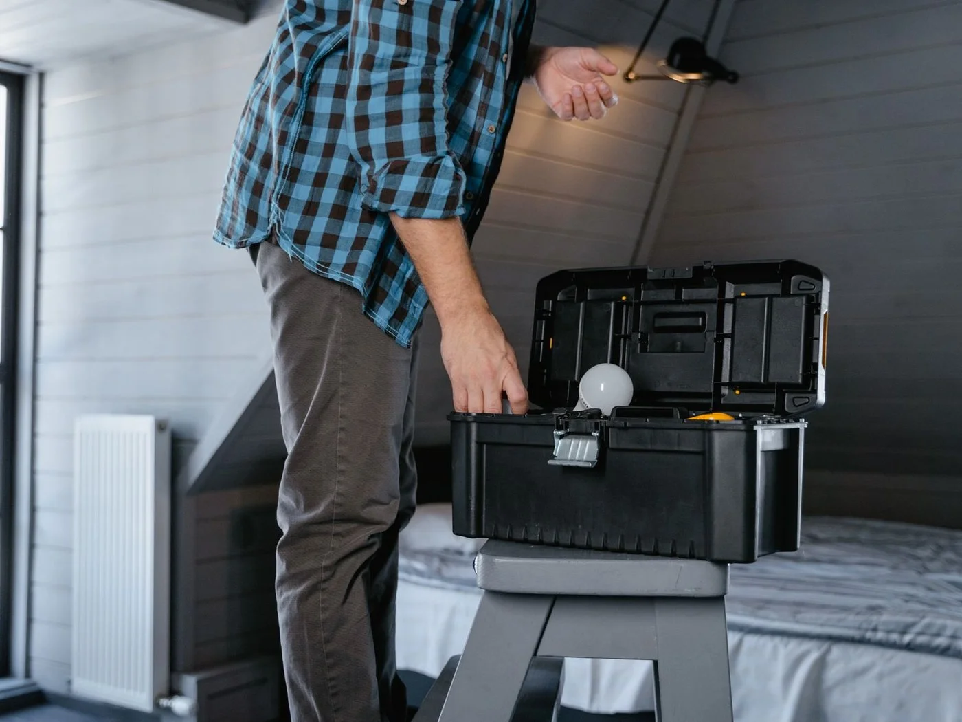 Landlord with a toolbox handling one more repair at the rental